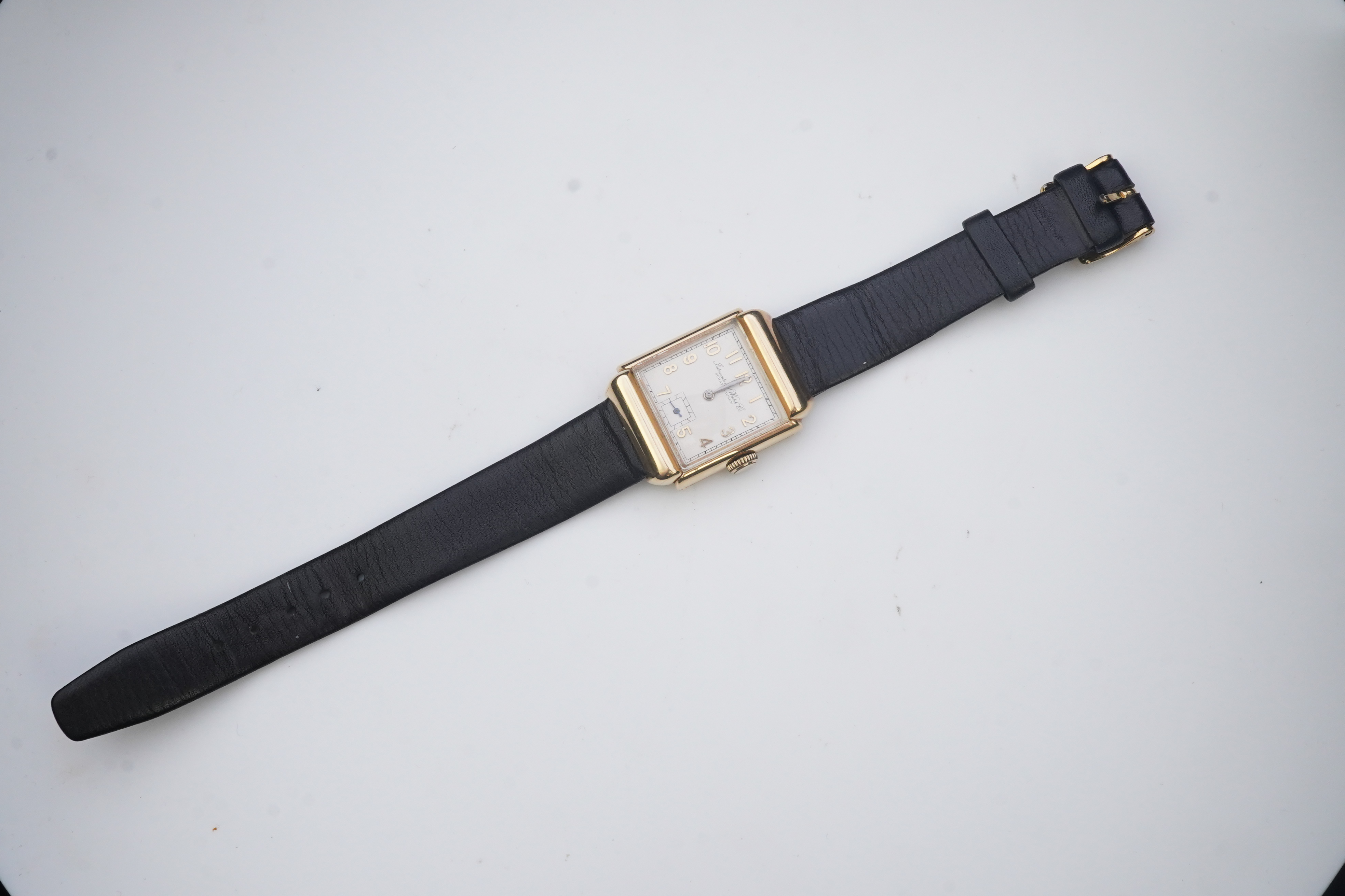 A gentleman's mid 20th century 14k gold International Watch Company manual wind wrist watch, on a later associated leather strap